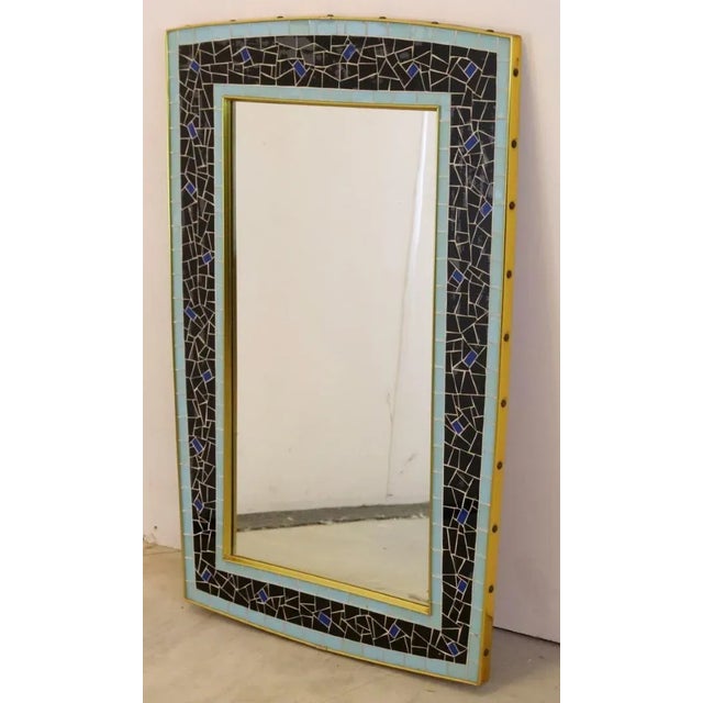 At the front of this mirror we see the characteristic colorful design and rounded corners that matches the 50s and early...