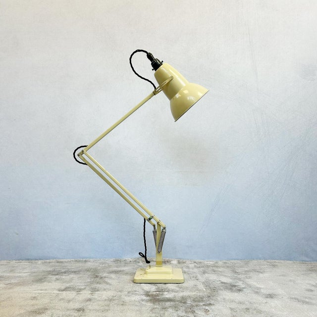 A vintage mid century cream Anglepoise model 1227 desk lamp designed by Herbert Terry. This model was was manufactured by...