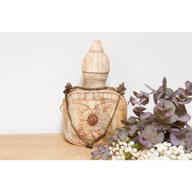 This hand-carved wooden bottle hails from India's Swat Valley. Originally used for carrying water on rural journeys, it...