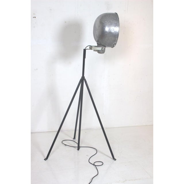 Industrial lamp with adjustable aluminum shade The lamp was originally intended to be attached to the ground but is also...