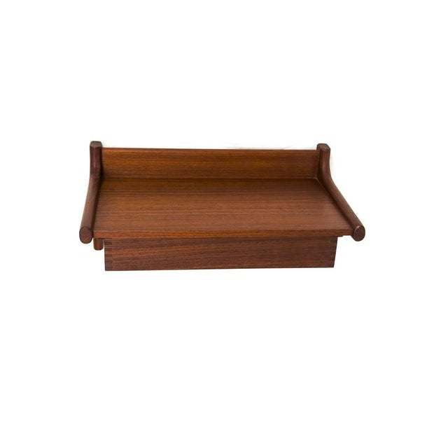 Elegant wall console with one drawer. High-quality construction, made primarily of solid teak. Mounts to the wall with two...