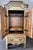 This monumental Old World armoire is a true statement piece, crafted entirely of solid wood with incredible architectural...
