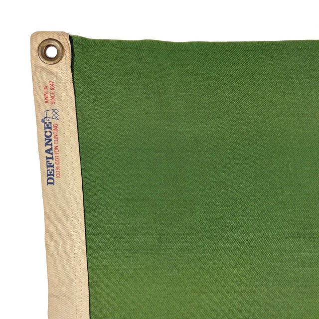 This vintage Washington state flag is made from a cotton cloth, with printed emblem sewn around its edge and visible on...