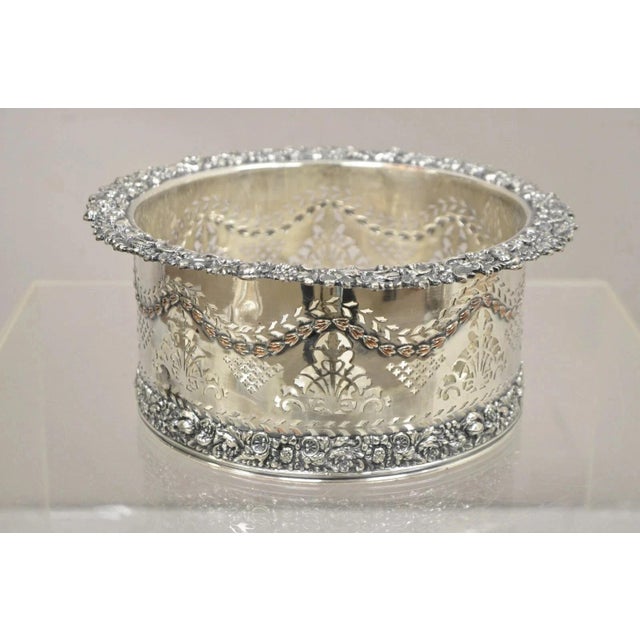 Antique English Sheffield Sterling Silver Mounted Silver Plated Champagne Bottle Coaster. Item features floral pierced...
