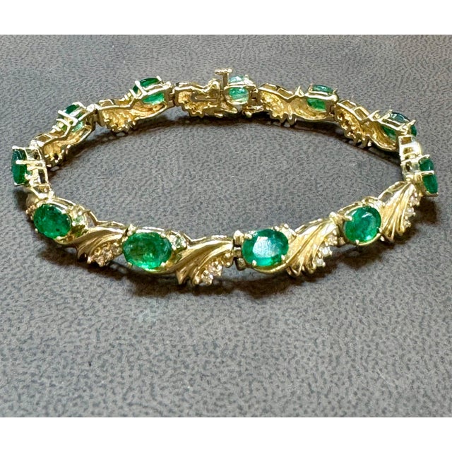 This exceptionally affordable Tennis bracelet has 11 large natural stones of oval Emeralds . Each Emerald is spaced by a...
