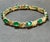 This exceptionally affordable Tennis bracelet has 11 large natural stones of oval Emeralds . Each Emerald is spaced by a...