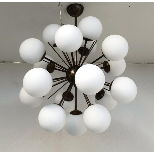 Italian sputnik chandelier with 18 matte white Murano glass globes mounted on brass frame in bronze finish / Made in Italy...