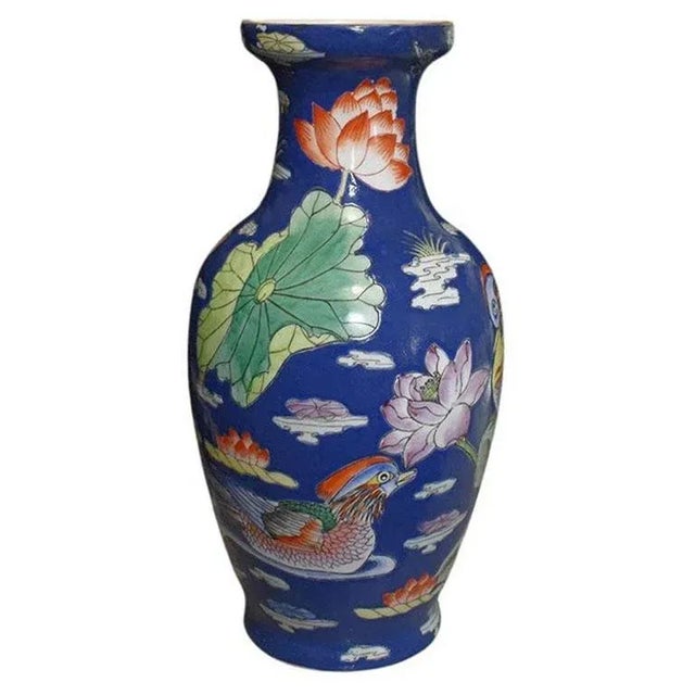 A tall ceramic chinoiserie vase in cobalt blue. We don't often come across deep blue chinoiserie vases, so when we do, we...