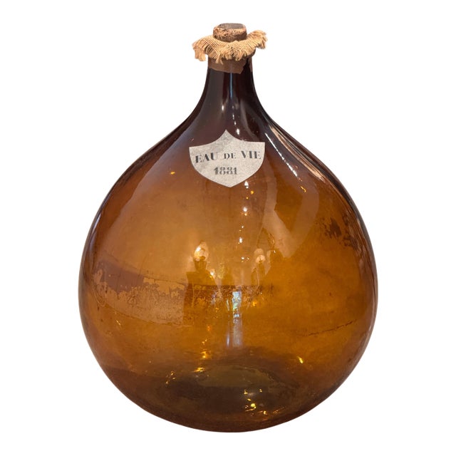 An Amber Glass Demijohn, Labeled Eau De Vie 1881 For Sale