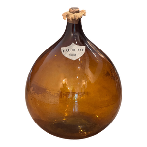 An Amber Glass Demijohn, Labeled Eau De Vie 1881