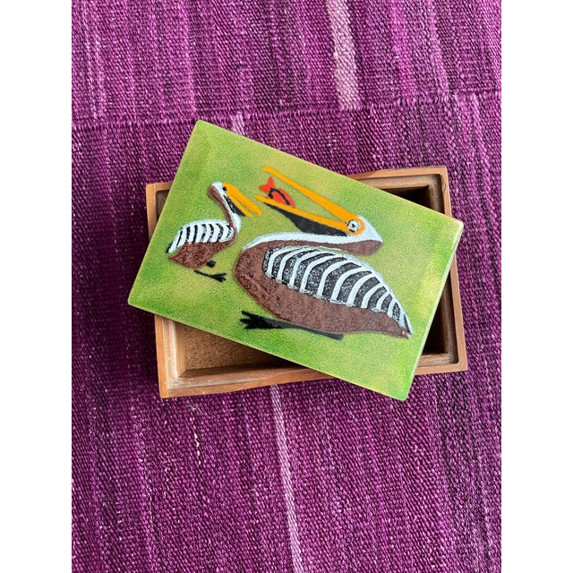 This adorable box of enamel over copper inlay top with a wood frame and cork interior is by Annemarie Davidson of a pair...