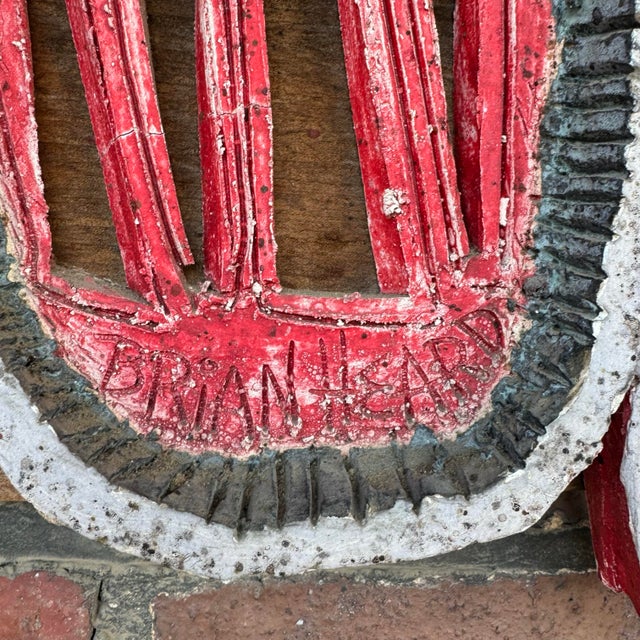 Abstract ceramic sculpture in a retro pattern featuring hues or red, blue, and white. This piece is mounted on an old...