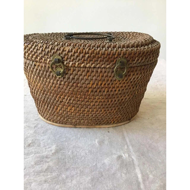 1920s Chinese wicker and brass lunch basket.