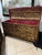 Profusely decorated with foliate sprays, conjoined scroll and gouge carved banding with bell flowers, the cover with metal...