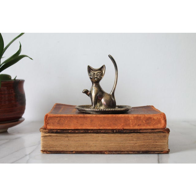 Vintage silver plate cat ring holder. Some tarnishing. Makers mark on bottom.