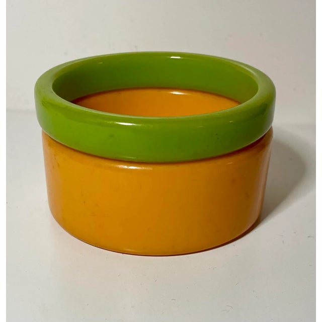 This is part of Chairish’s Costume Jewelry assortment. Old bakelite bracelets in Goldenrod and green. I have 3 sets should...