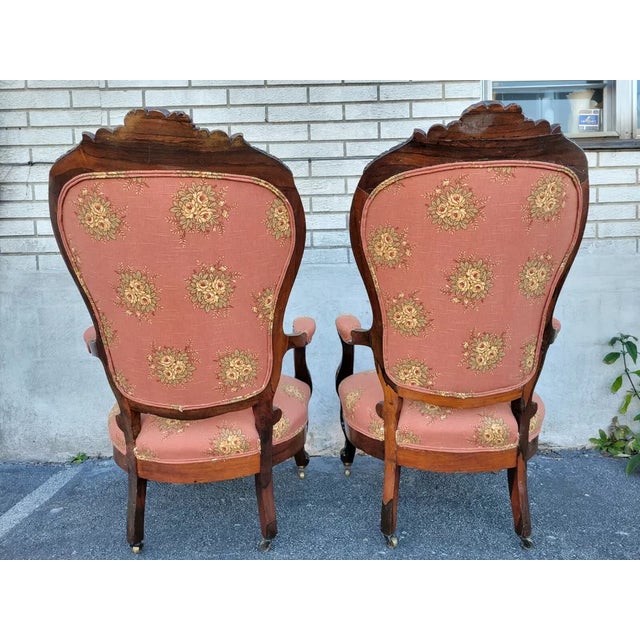 Exquisite 19th-century American carved rosewood armchairs, showcasing exceptional craftsmanship and timeless elegance....