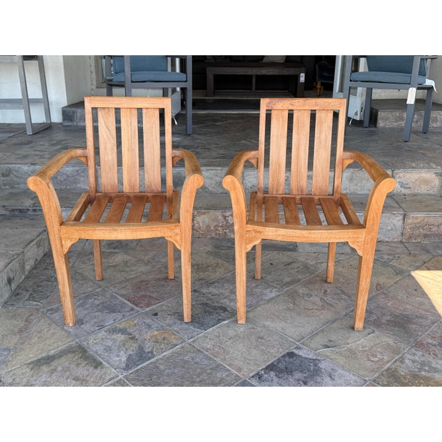 Design Plus Gallery presents a Pair of Sage Outdoor Teak Wood Armchairs from Ash & Ember. These stacking chairs are...