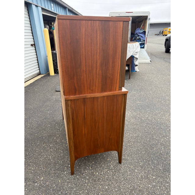 **This piece has been professionally refinished! Super clean condition Mid-Century Modern walnut and rosewood two doors...