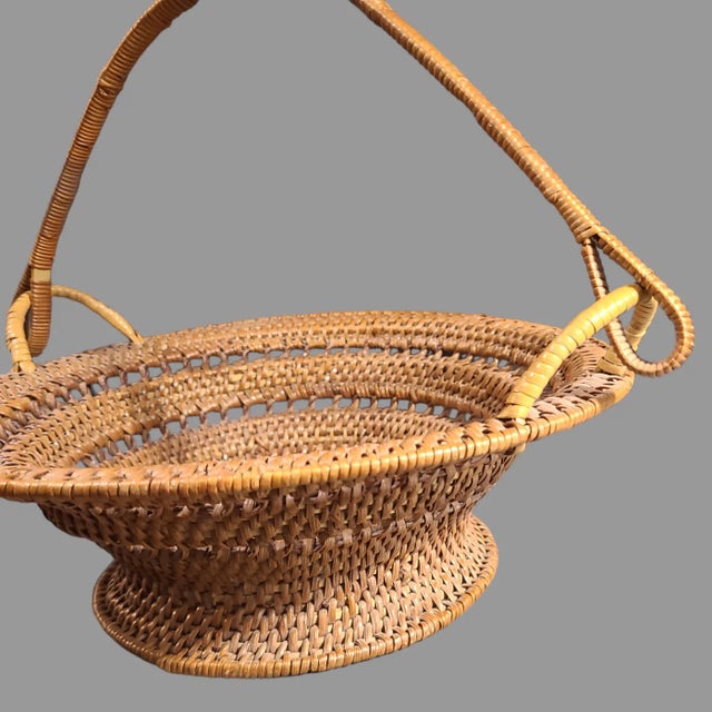This vintage wicker basket is a beautifully crafted piece, perfect for any occasion. The tightly woven design showcases...