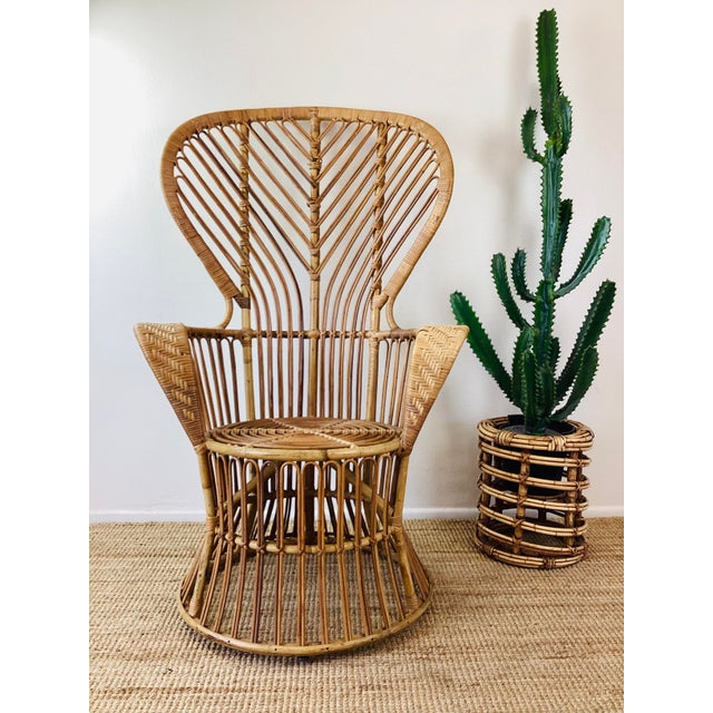 Vintage 1960s Rattan Chair made of rattan natural color tall fan back "peacock" style in the style of gio ponti Great...