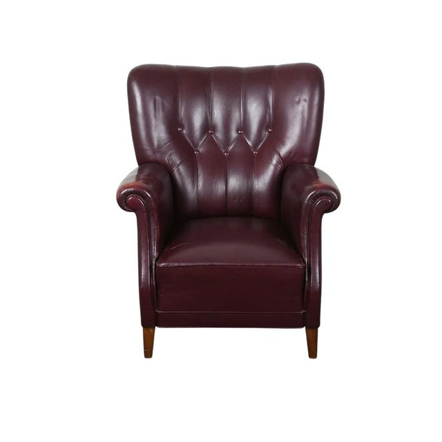 A delightful Old School (circa 1950's/60's) tufted / bolstered leather lounge chair with an unusual hexagonal Scandinavian...