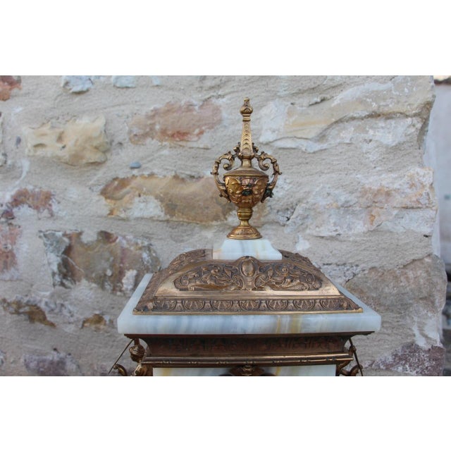 An unusual clock model known as the "mahout clock," made of onyx and bronze, dating from the late 19th century. Minor wear...