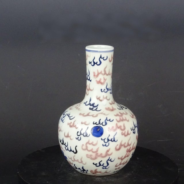 W-12cm,H-21.4cm This Blue and White Underglaze Red Porcelain Tianqiu Vase is a beautifully hand-painted piece originating...