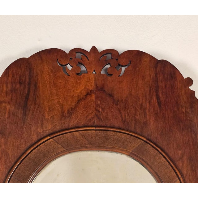 A nice example of a Queen Anne George I English walnut pier mirror. This piece has an engraved and divided mirror plate....