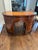 The shaped kidney-form top above a central kneehole, flanked by graduated drawers and curved cupboard sections, the whole...