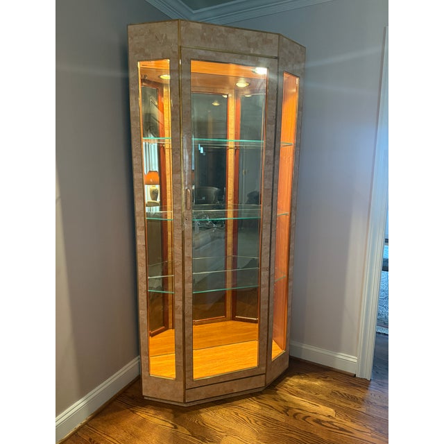 A stunning vintage tessellated travertine stone display cabinet attributed to Maitland Smith, c. 1980 but with no visible...