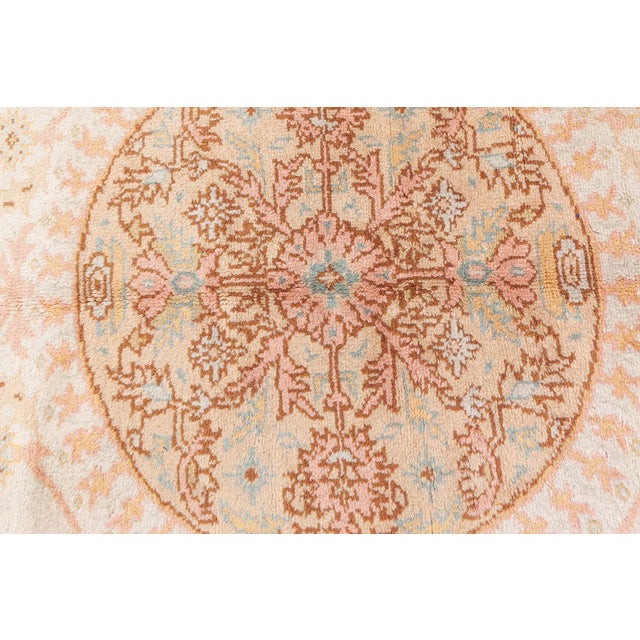 This exquisite antique Turkish Oushak rug, measuring approximately 13 by 11 feet, showcases the timeless elegance and...