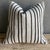 Creamy white hemp rug pillow with stripes. Soft hand, linen blend backing with zipper closure. Spot cleaning is...