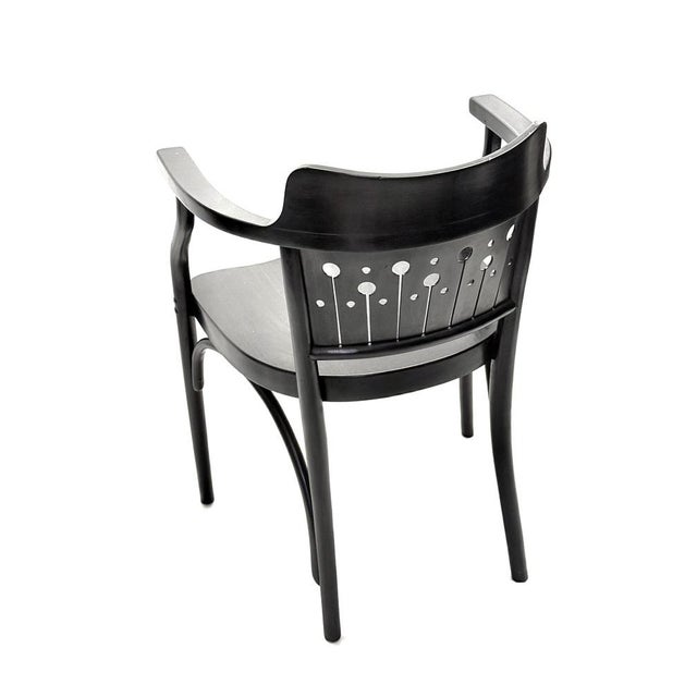 Elegant Viennese Secession armchair, manufactured by Thonet in Austria circa 1900–1910. The design reflects the influence...