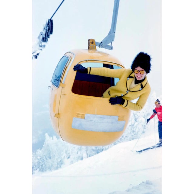 Sugarbush Ski Lift A skier peeks out from her ski lift pod on the slopes of Sugarbush Vermont ski resort, 1954 (Printed...