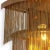 Three tiers of thin chains remind one of fringe flapper dresses from the 1920s. Provided with an antique brass finish,...