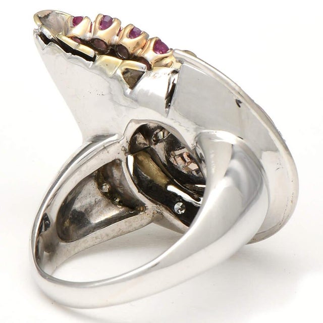 Looking like a miniature cornucopia, this retro modern-style ring features multiple stones that hearken back to a simpler...