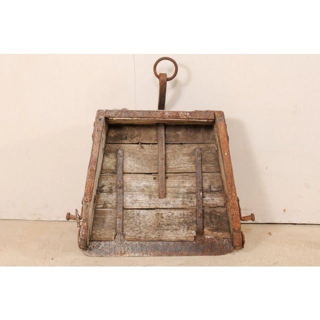 A 19th century Spanish scoop or plow of wood and iron. This antique farming tool from Spain features a wonderfully...