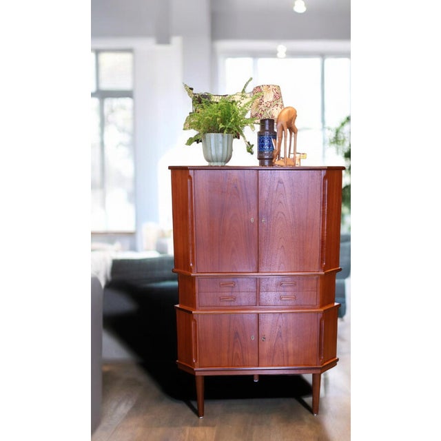A very unusual corner cabinet with fantastic details that really catches the eye and adds a unique charm to any room! A...