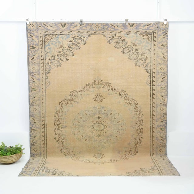 Vintage Turkish Hand-Knotted vintage rug is a semi-antique vintage Area rug.'70s Eastern region of Turkey's unique rug is...