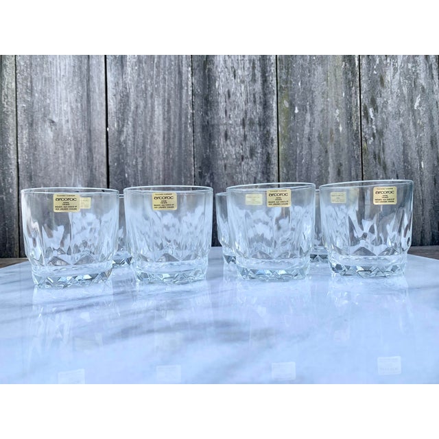 A set of eight new old stock Arcoroc tempered glass juice glasses with original intact box and sticker labels on each....