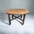 A 1960s Edward Wormley's For Dunbar Round Coffee Table. Features Brass accents on the bottom of each of the legs. The...