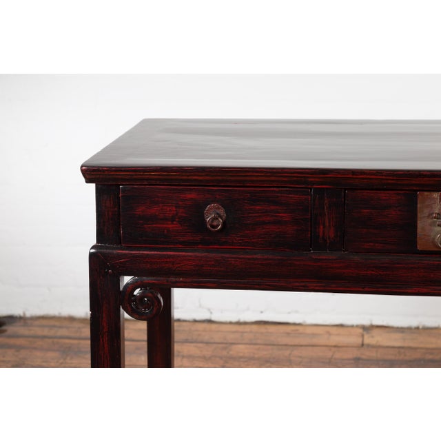 Early 20th Century Chinese Antique Lacquered Wooden Desk with Four Drawers and Curling Scrolls For Sale - Image 5 of 12