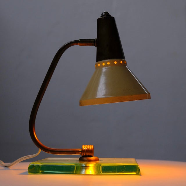 In good condition, working, usual signs of wear on the metal shade, there is a small glue drop on the brass cone (see...