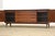 A mid century modern cherry sideboard credenza designed by Lorenzo Rutili for Johnson Furniture. Professionally refinished...