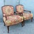 A timeless pair of French Provincial lounge chairs by Woodmark, showcasing elegant carved walnut frames with graceful...