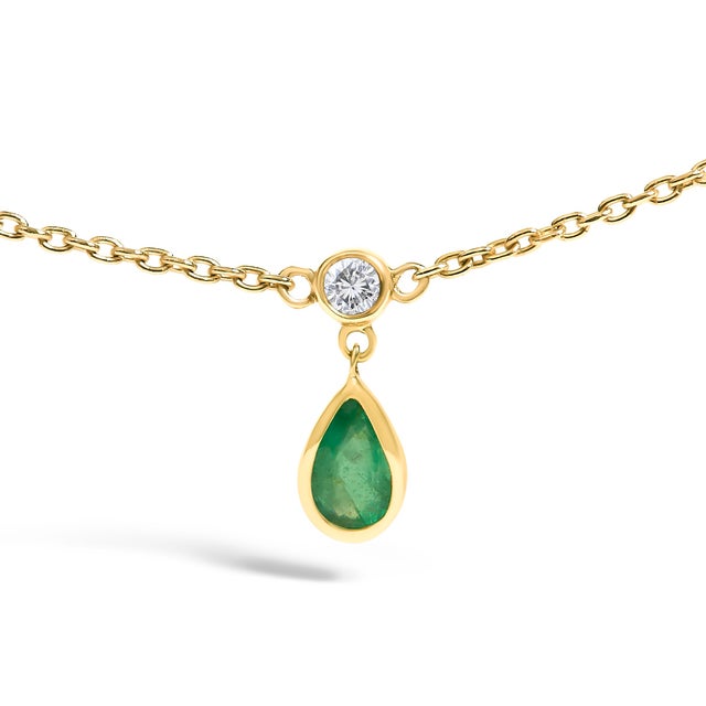 Glimmering in the light, this exquisite 18-inch necklace is forged from luminous 10K yellow gold, creating a canvas that...