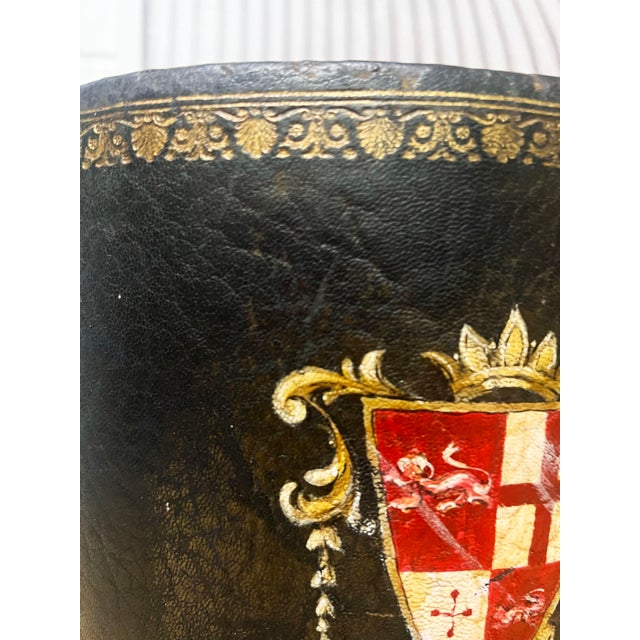 Impressive oval shaped Leather Waste Bin with gilt border trim on top and bottom, and especially nice painted Coat of Arms...