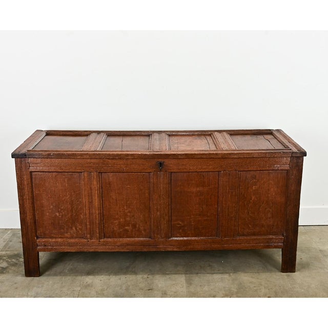 Dimensions: 30 ¾” H x 65 ¾” W x 25 ¼” D A solid oak paneled coffer from the Netherlands, circa 1800. This sturdy trunk has...