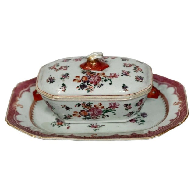 Pair of Chinese Export Famille Rose porcelain sauce tureens, each having a unique cover design and matching platters. They...